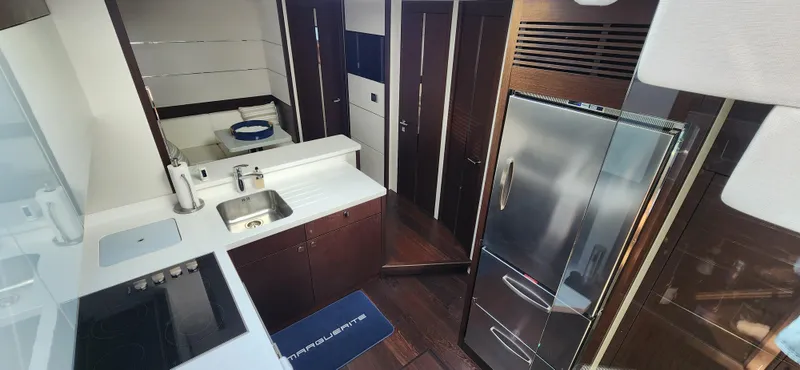 Slide: The Image of Modern kitchen interior of 2020 Sunseeker Predator 74 XPS yacht with stainless steel appliances. - 47