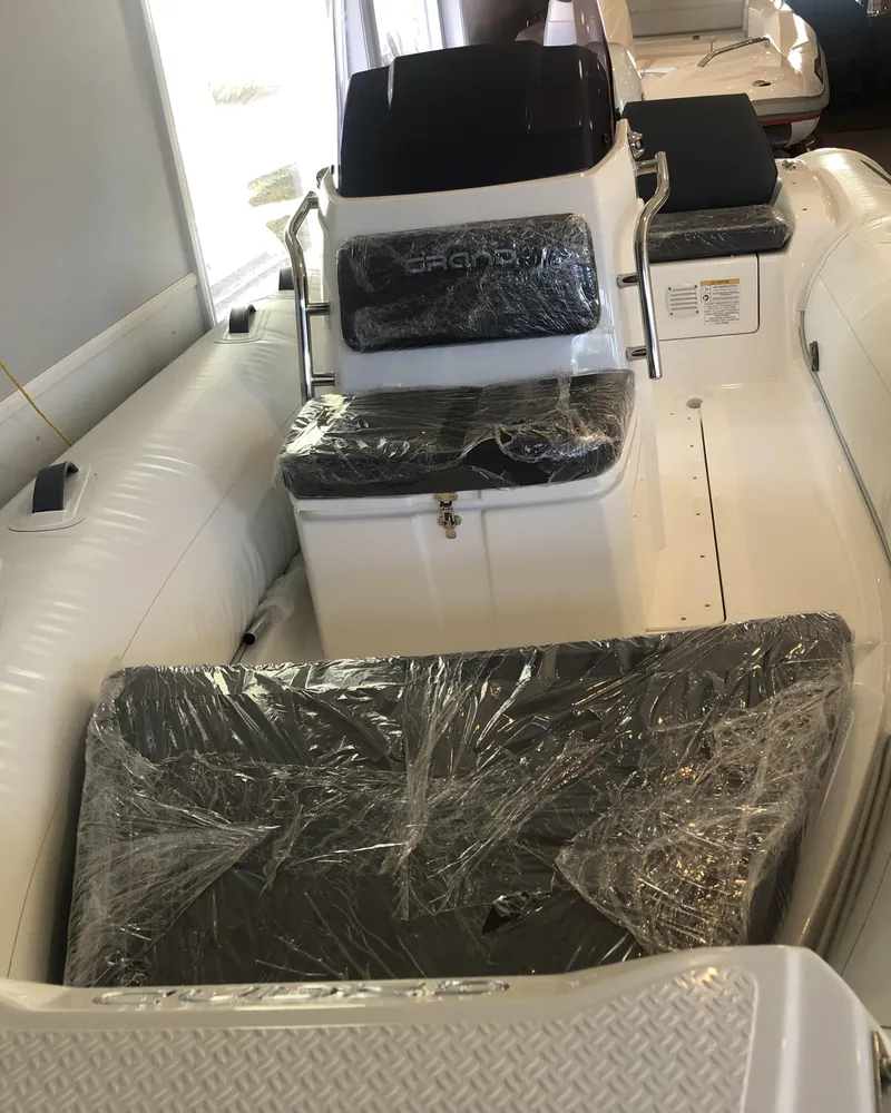 Slide: The Image of 2023 Grand G 420 boat interior with protective plastic covers. - 3