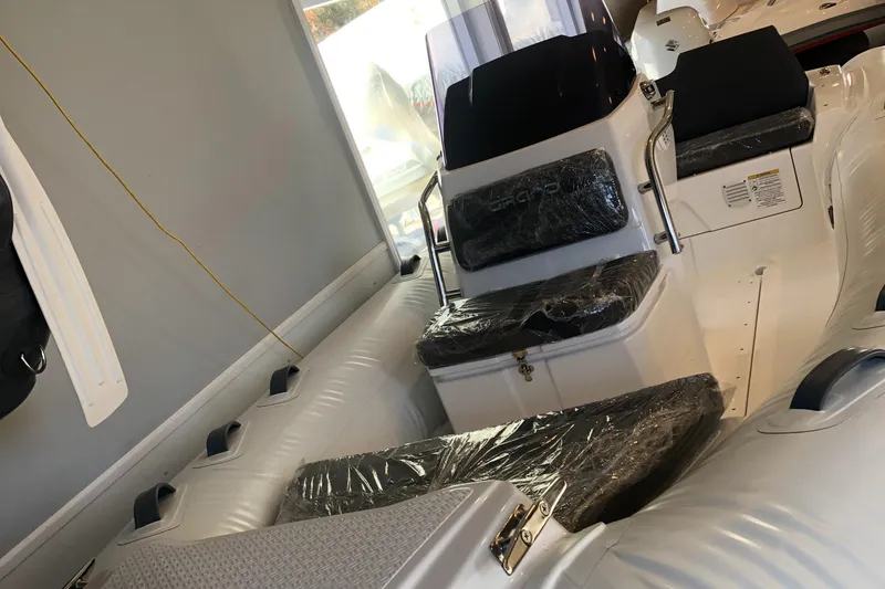 Slide: The Image of 2023 Grand G 420 inflatable boat interior with seating and console. - 4