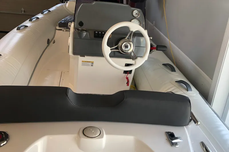 Slide: The Image of 2023 Grand G 420 boat interior with steering wheel and seating. - 6