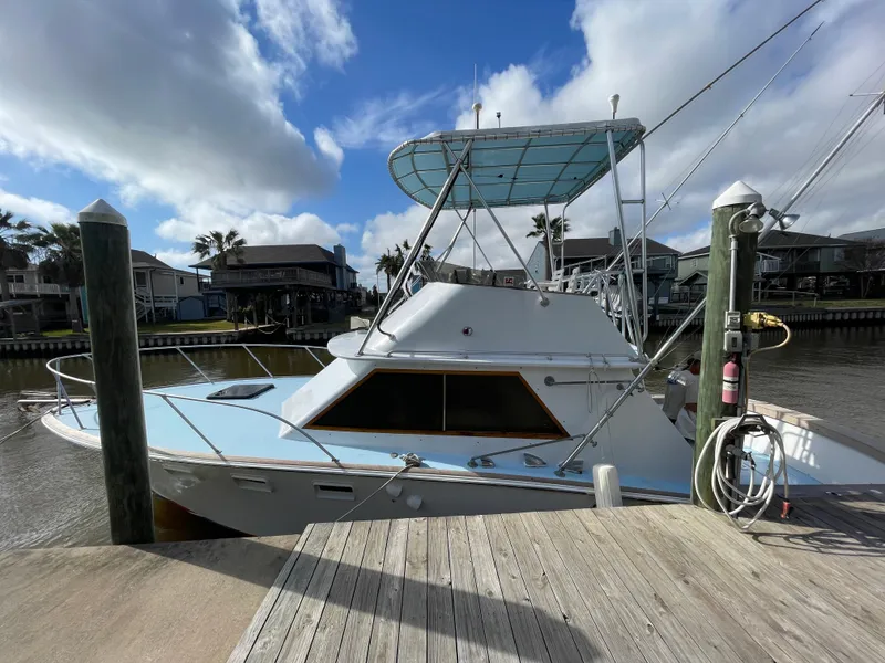 Slide: The Image of 1975 Custom 36 Matlack Tournament SF boat docked at a marina. - 12