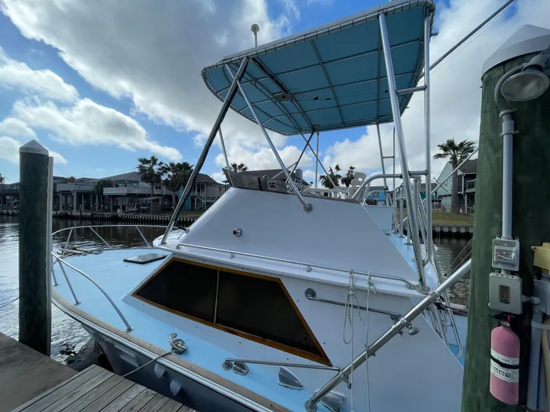 Slide: The Image of 1975 Custom 36 Matlack Tournament SF boat docked at marina. - 13