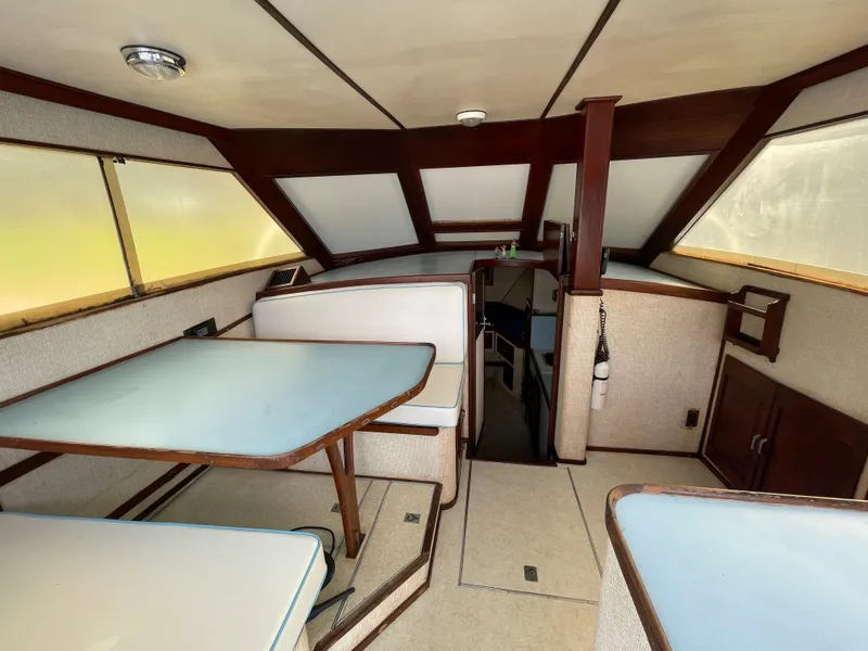 Slide: The Image of Interior of a 1975 Custom 36 Matlack Tournament SF boat with seating and table. - 26