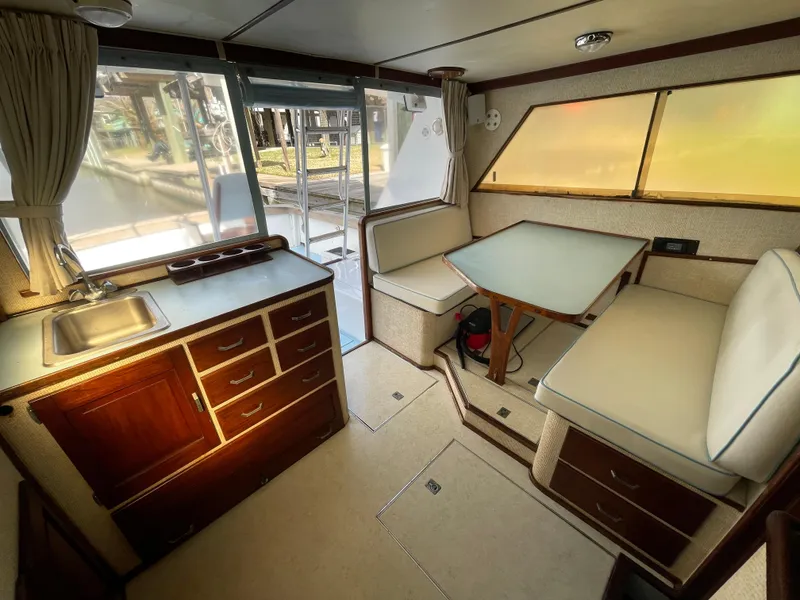 Slide: The Image of Interior of 1975 Custom 36 Matlack Tournament SF boat with kitchenette and dining area. - 30