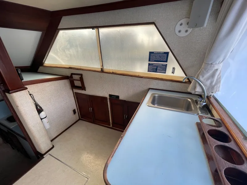 Slide: The Image of 1975 Custom 36 Matlack Tournament SF boat interior with kitchenette and sink. - 31