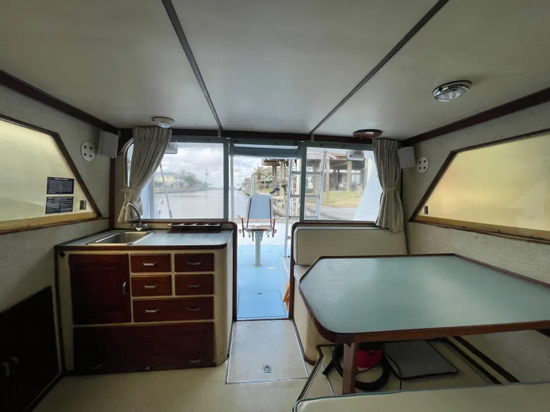 Slide: The Image of Interior of 1975 Custom 36 Matlack Tournament SF boat with kitchen and dining area. - 33