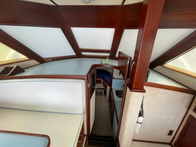 Slide: The Image of Interior of a 1975 Custom 36 Matlack Tournament SF boat with wooden accents. - 35