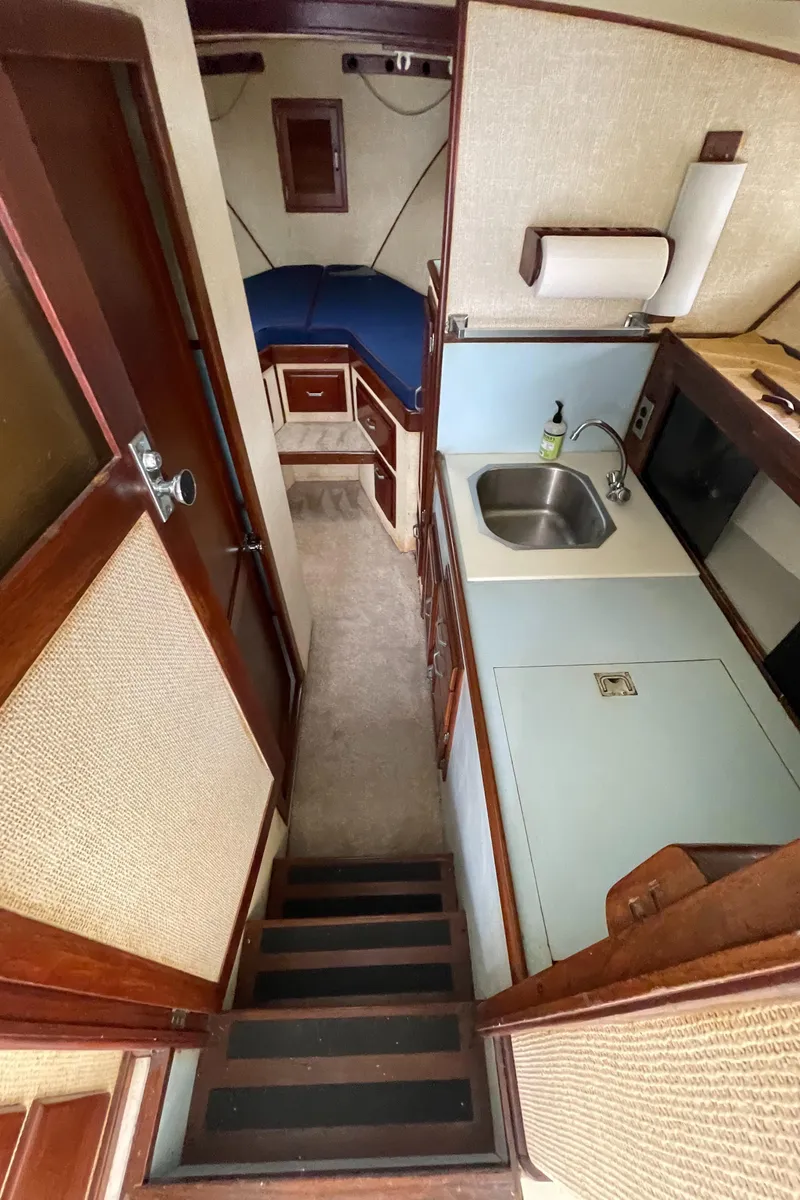 Slide: The Image of 1975 Custom 36 Matlack Tournament SF interior with kitchenette and sleeping area. - 36