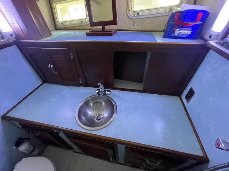 Slide: The Image of 1975 Custom 36 Matlack Tournament SF boat bathroom sink and counter. - 45
