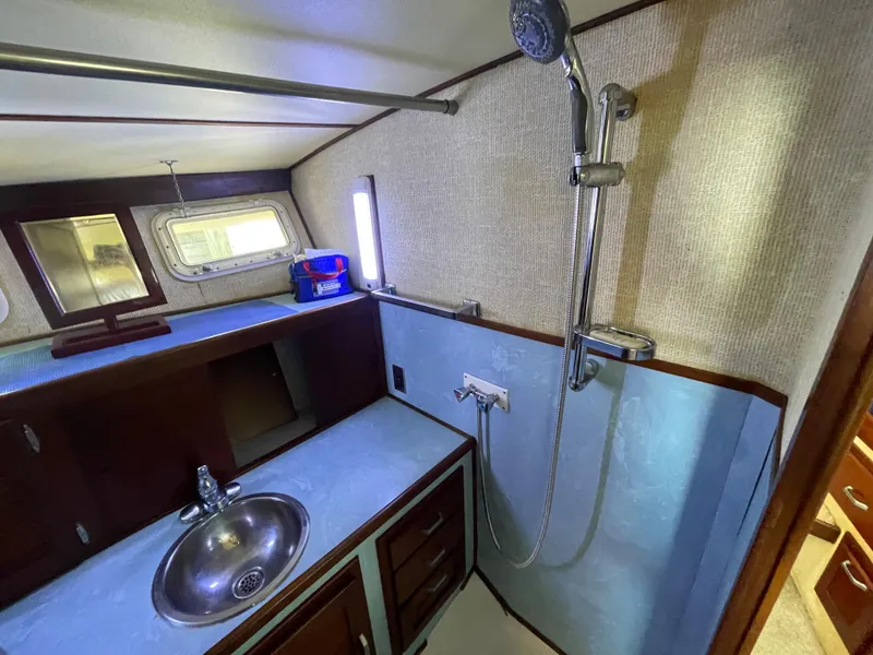 Slide: The Image of 1975 Custom 36 Matlack Tournament SF bathroom with sink and shower. - 47