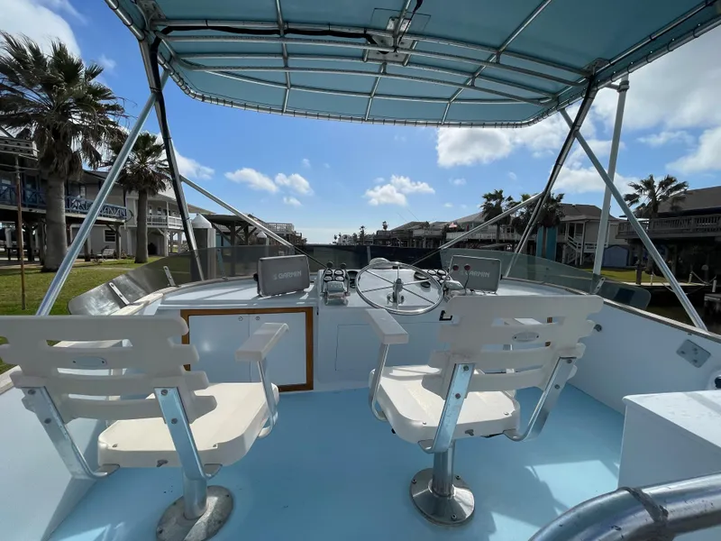 Slide: The Image of 1975 Custom 36 Matlack Tournament SF boat with dual helm seats and canopy. - 48