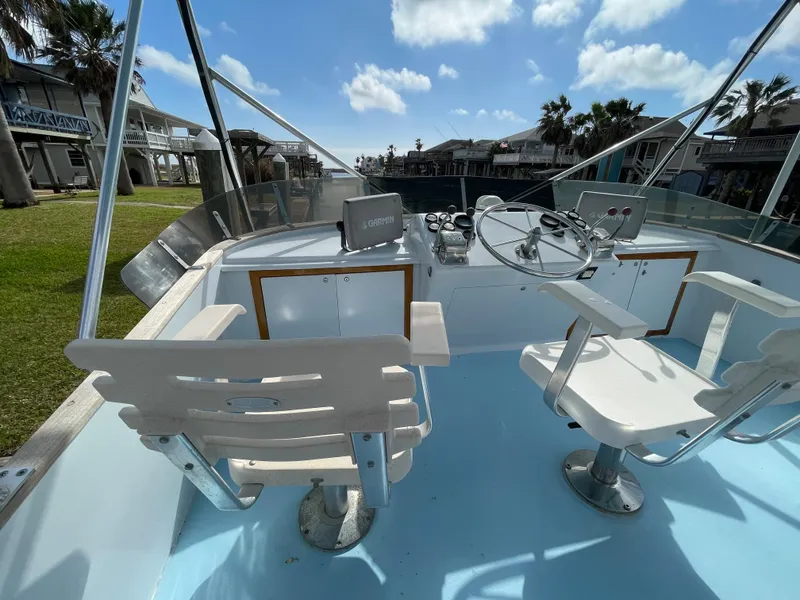 Slide: The Image of Cockpit of 1975 Custom 36 Matlack Tournament SF boat with steering wheel and seats. - 49