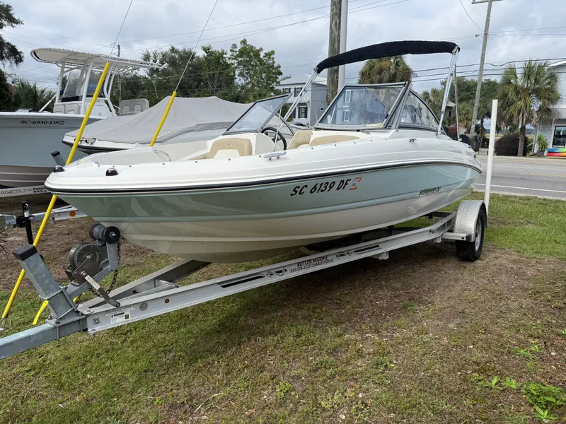 The Image of 2017 Key West 219 FS boat on trailer outdoors. - 1