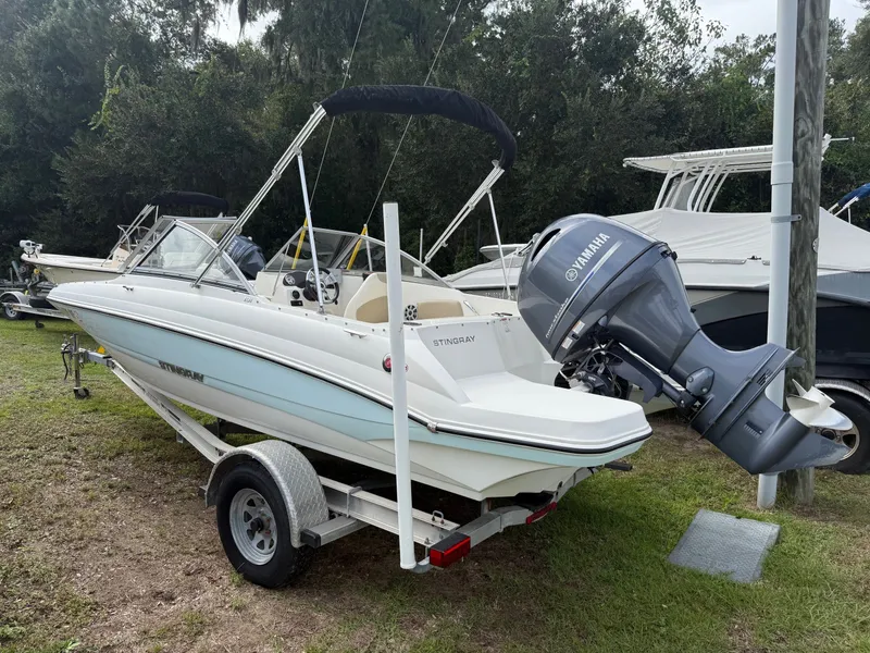 Slide: The Image of 2017 Stingray 191DC boat with Yamaha outboard motor on a trailer. - 7