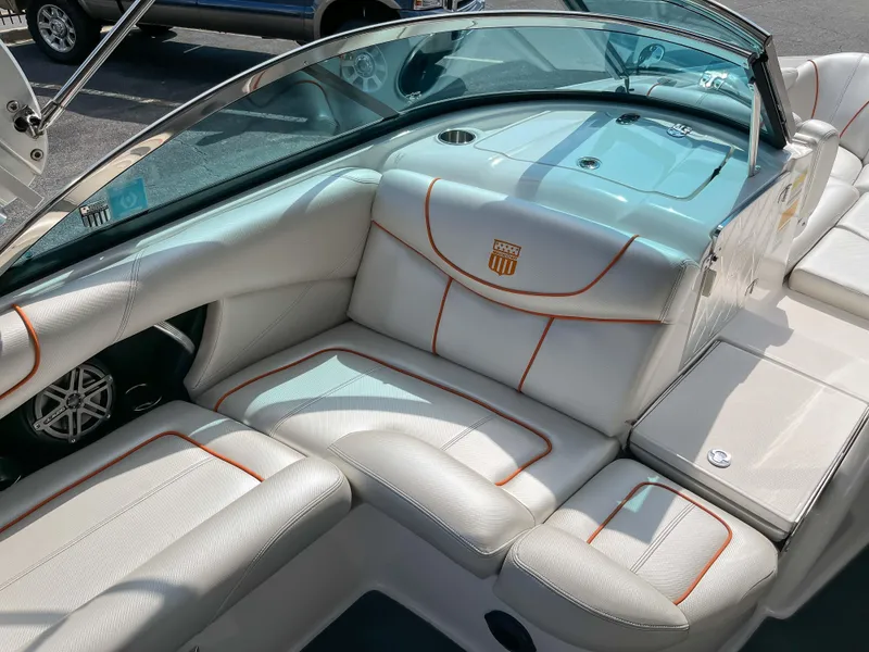 Slide: The Image of 2013 MasterCraft XStar boat interior with white and orange upholstery. - 14
