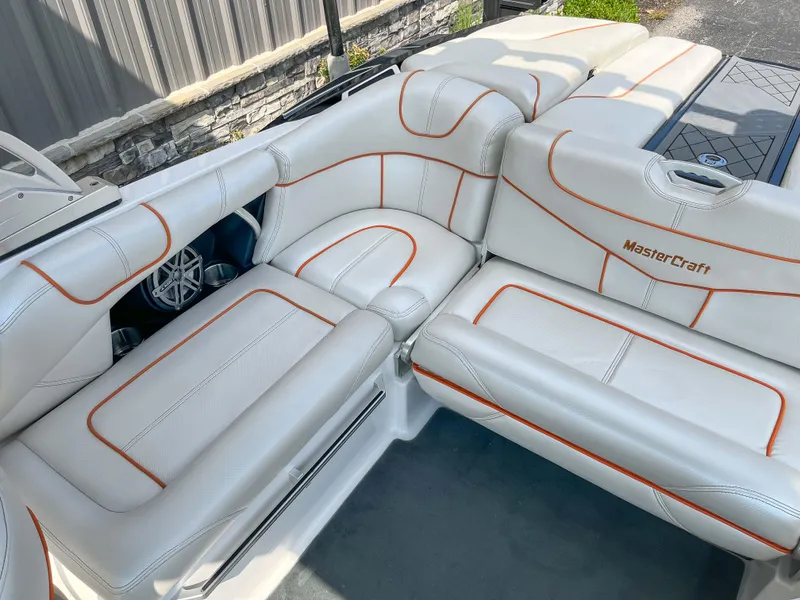 Slide: The Image of 2013 MasterCraft XStar boat interior with white and orange upholstery. - 9