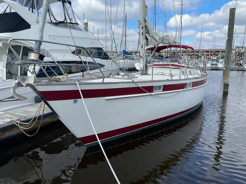 The Image of 1983 Najad 371 American CC sailboat docked at a marina. - 0