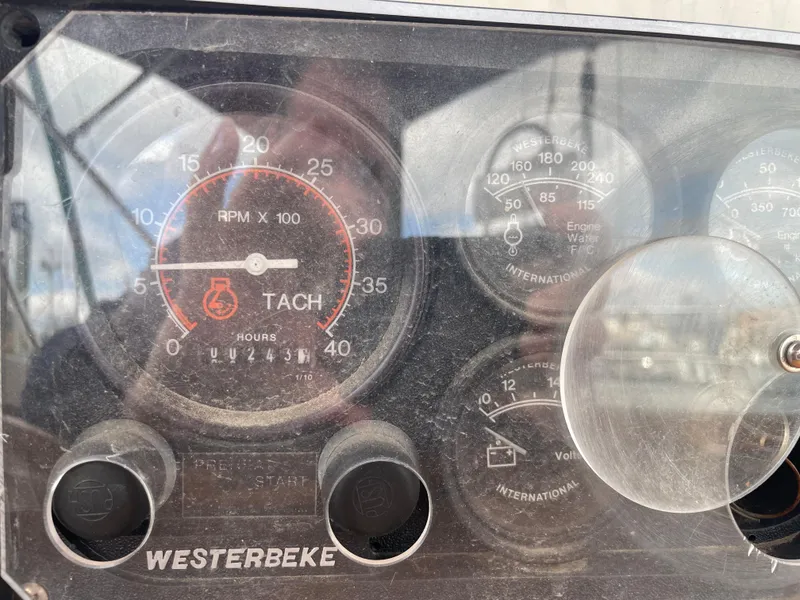 Slide: The Image of Dashboard of a 1983 Najad 371 American CC sailboat with Westerbeke tachometer. - 16