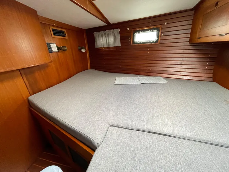 Slide: The Image of Cozy cabin interior of 1983 Najad 371 American CC sailboat with wooden paneling. - 22