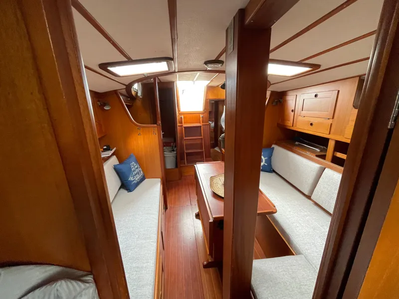 Slide: The Image of Interior of 1983 Najad 371 American CC sailboat with wooden furnishings and seating area. - 30