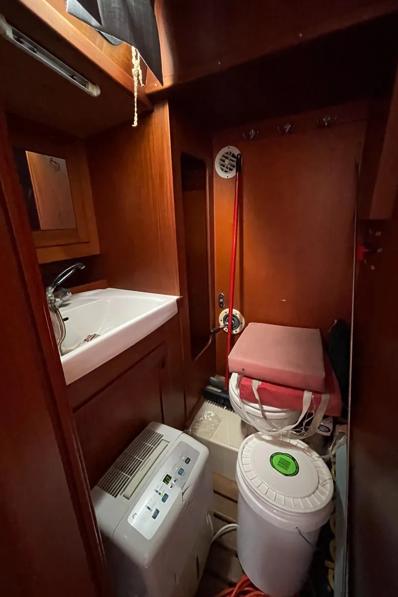 Slide: The Image of 1983 Najad 371 American CC yacht interior with sink and storage area. - 34