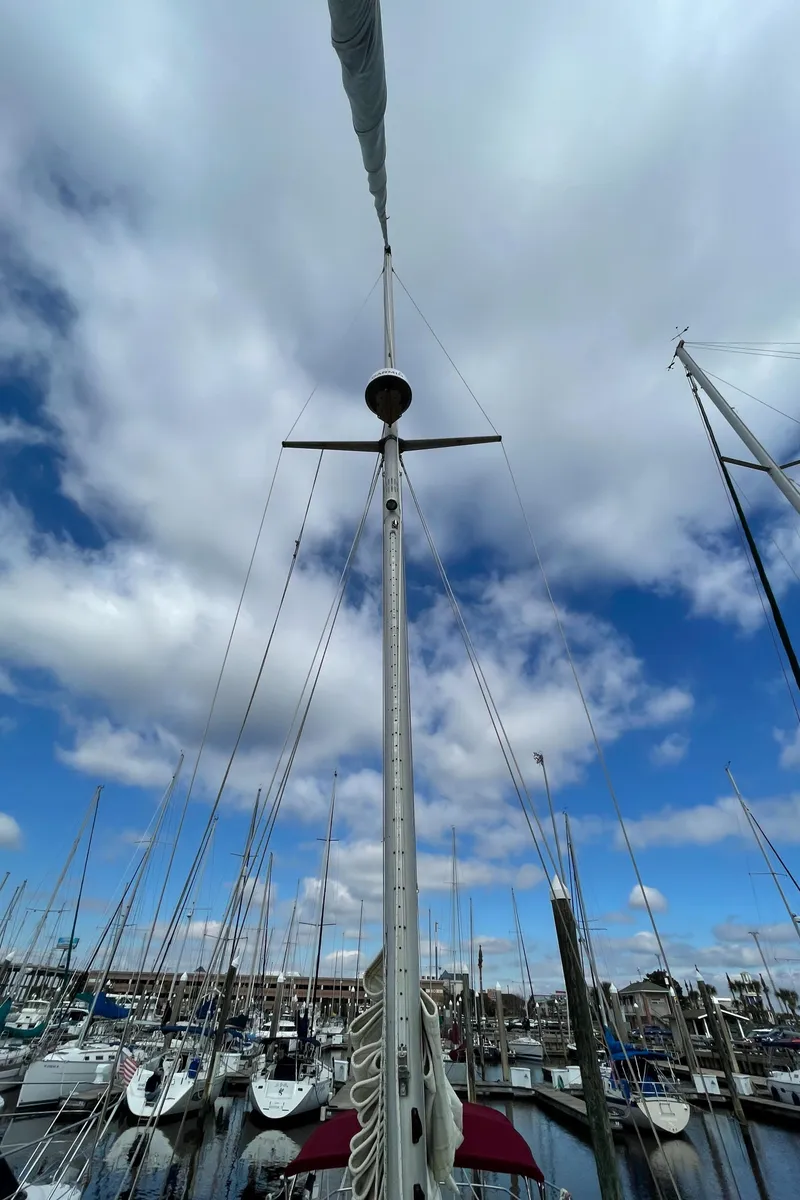 Slide: The Image of 1983 Najad 371 American CC sailboat mast in a marina. - 5