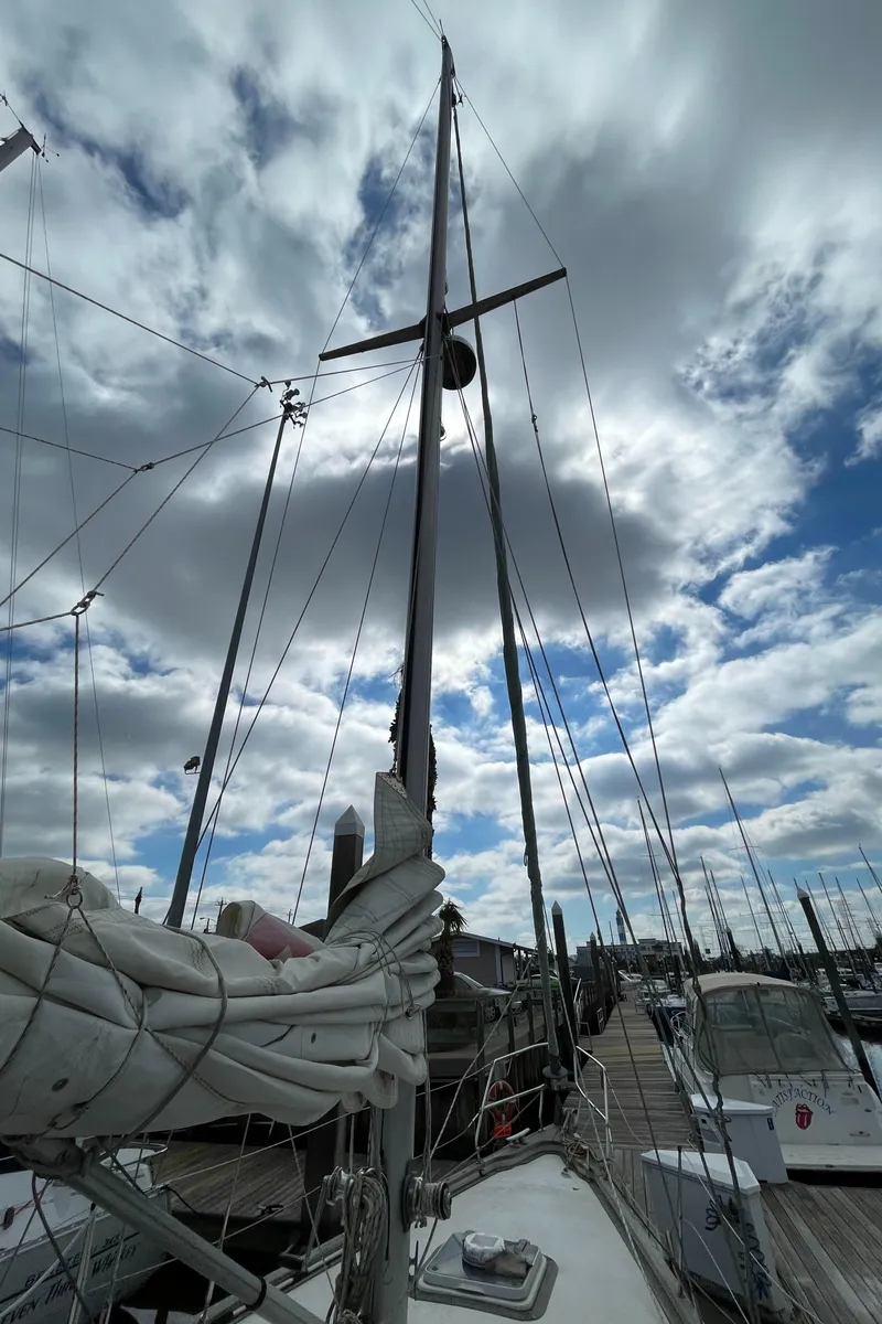Slide: The Image of Sailboat Najad 371 American CC 1983 docked at marina under cloudy sky. - 6