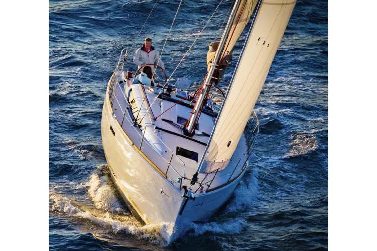 Slide: The Image of 2019 Jeanneau Sun Odyssey 389 sailing on open water, viewed from the front. - 1