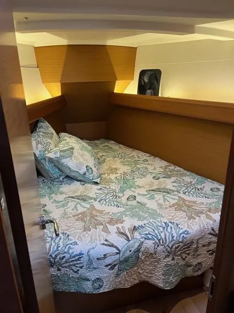 Slide: The Image of 2019 Jeanneau Sun Odyssey 389 cabin with nautical-themed bedding. - 20