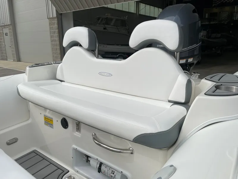 Slide: The Image of 2023 Zodiac Yachtline 490 Deluxe NEO 90hp boat interior with white seating. - 14
