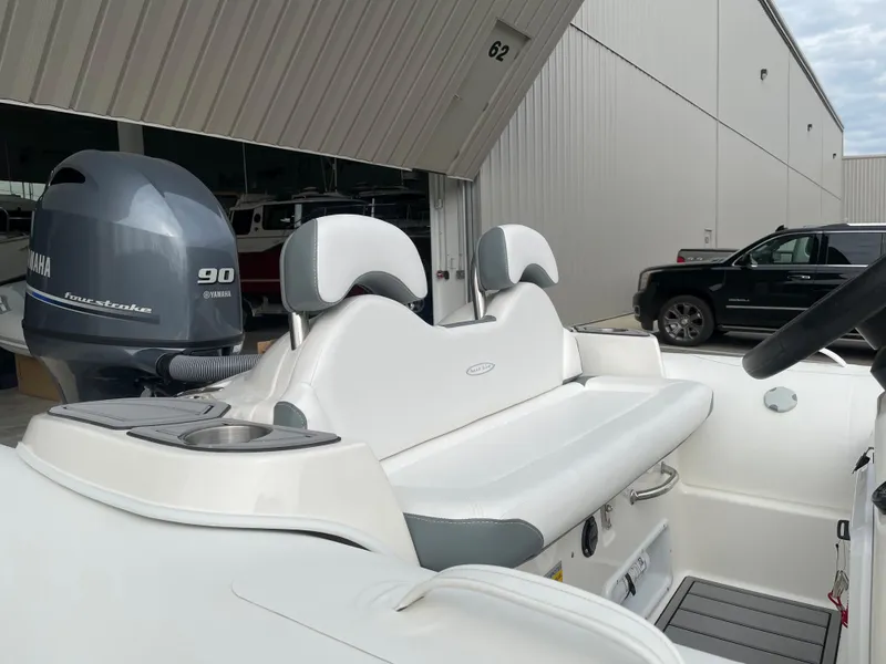 Slide: The Image of 2023 Zodiac Yachtline 490 Deluxe NEO 90hp boat with Yamaha engine in stock. - 2