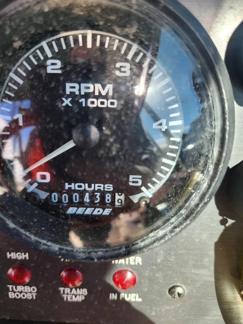 Slide: The Image of Close-up of Albin 28 tachometer showing 4389 hours, with indicator lights below. - 8