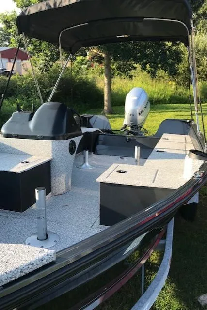 Slide: The Image of 2023 Polar Kraft Outlander 165 SC fishing boat with canopy and motor. - 11