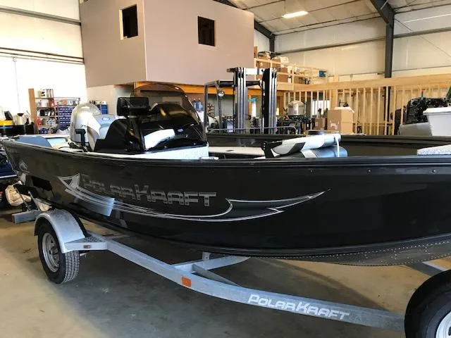 Slide: The Image of 2023 Polar Kraft Outlander 165 SC boat in a warehouse. - 4