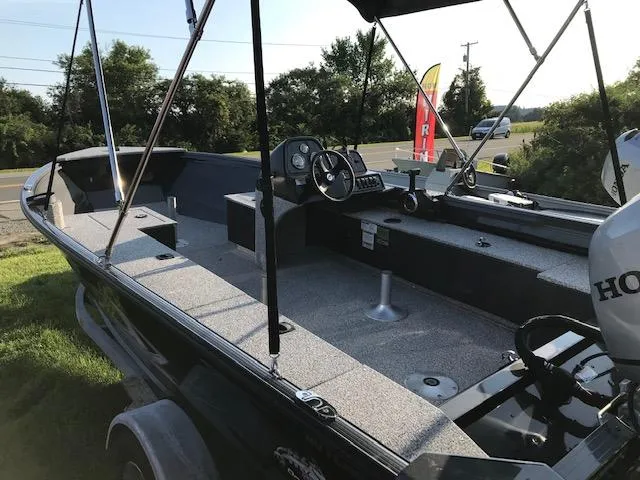 Slide: The Image of 2023 Polar Kraft Outlander 165 SC fishing boat with Honda outboard motor. - 5