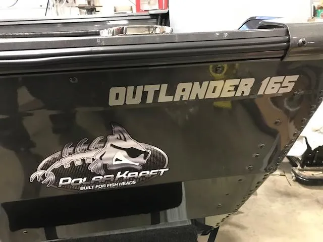 Slide: The Image of 2023 Polar Kraft Outlander 165 SC boat rear view with logo and model name. - 6
