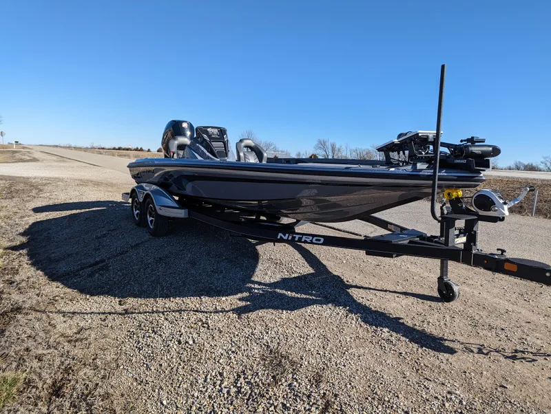 Slide: The Image of 2023 Nitro Z21 XL Pro boat on trailer under clear blue sky. - 10