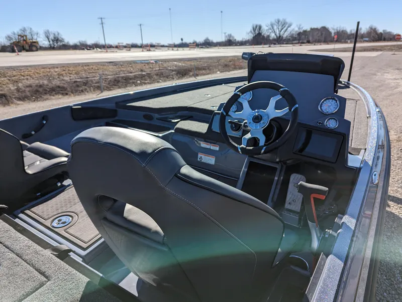 Slide: The Image of 2023 Nitro Z21 XL Pro boat interior with steering wheel and dashboard. - 11