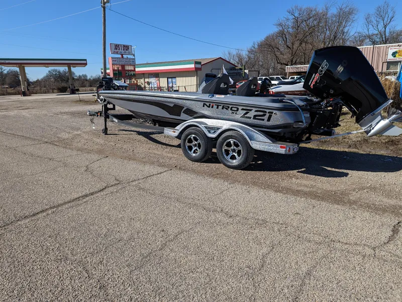 Slide: The Image of 2023 Nitro Z21 XL Pro boat on trailer in parking lot. - 2