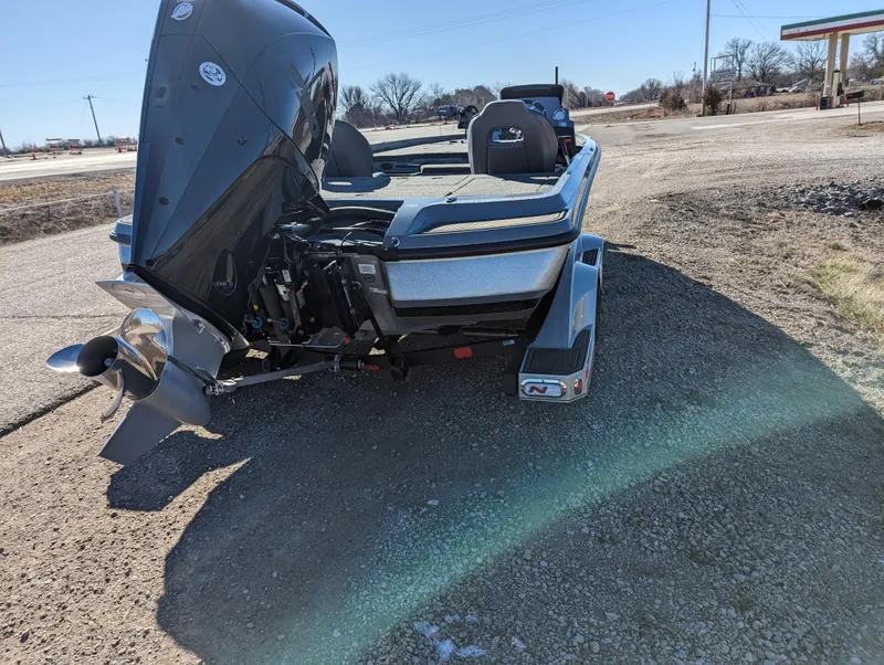 Slide: The Image of 2023 Nitro Z21 XL Pro boat on gravel road, rear view. - 5