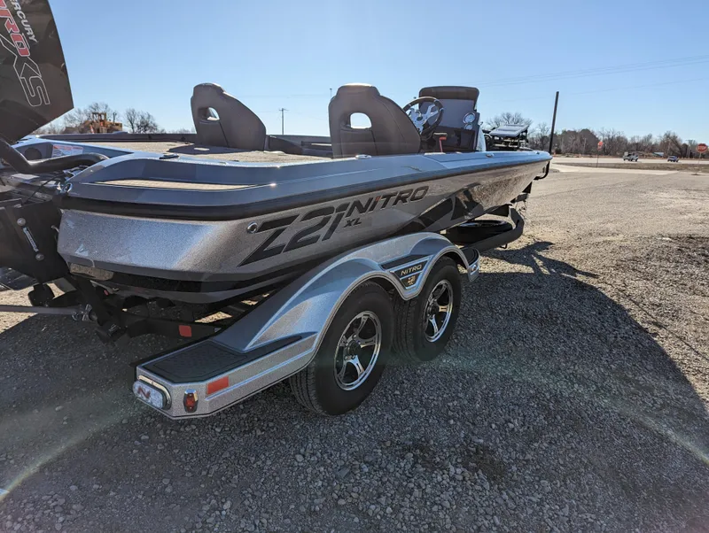 Slide: The Image of 2023 Nitro Z21 XL Pro boat on a trailer in a sunny outdoor setting. - 7