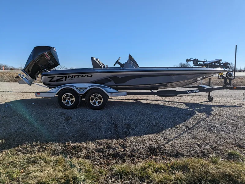 Slide: The Image of 2023 Nitro Z21 XL Pro boat on trailer, side view, outdoors. - 8