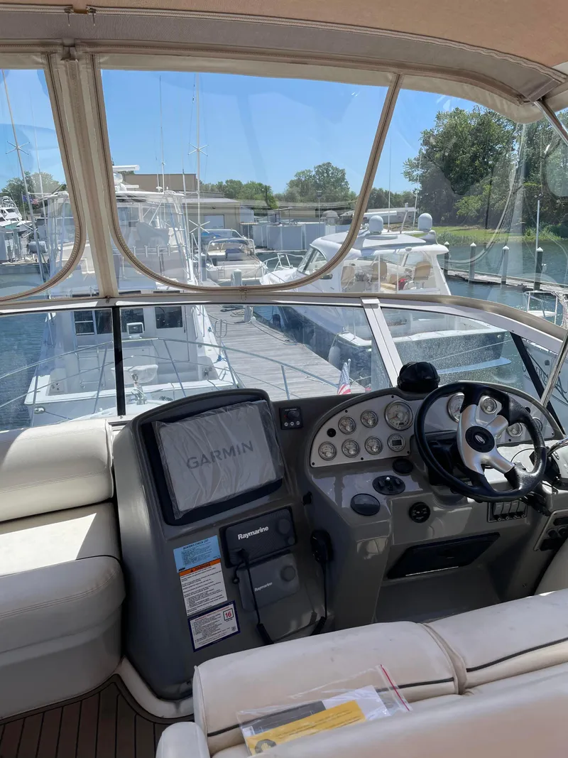 Slide: The Image of Helm of 2006 Cruisers Yachts 385 Motoryacht with Garmin and Raymarine navigation systems. - 17