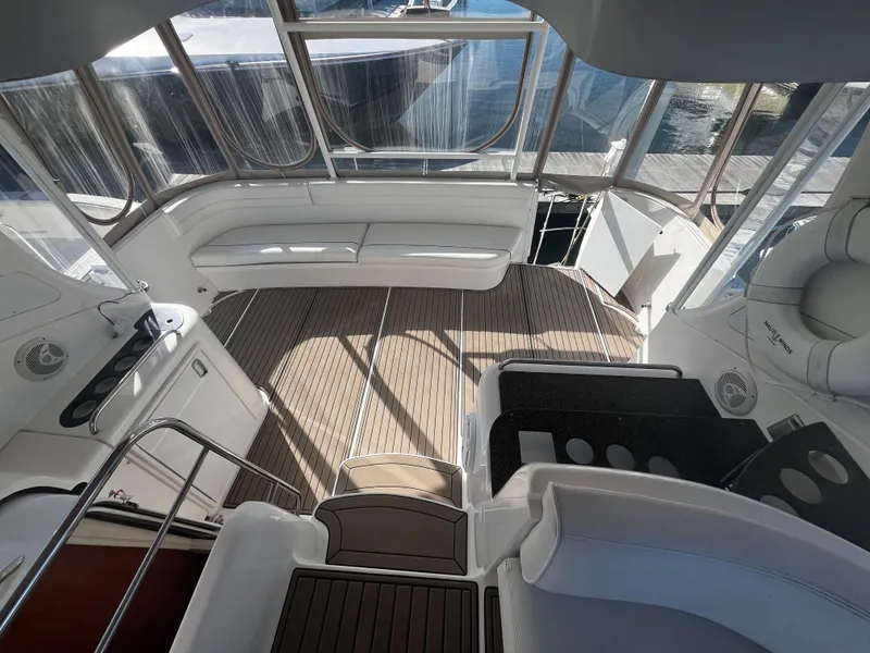 Slide: The Image of 2006 Cruisers Yachts 385 Motoryacht interior with white seating and wood flooring. - 20