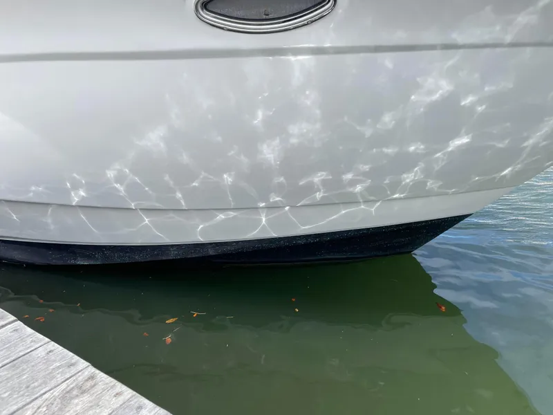 Slide: The Image of Close-up of 2006 Cruisers Yachts 385 Motoryacht hull reflecting water. - 4