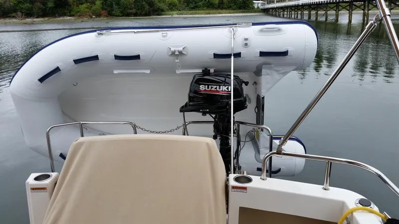 Slide: The Image of 2017 Cutwater C-28 with Suzuki outboard motor and dinghy. - 3