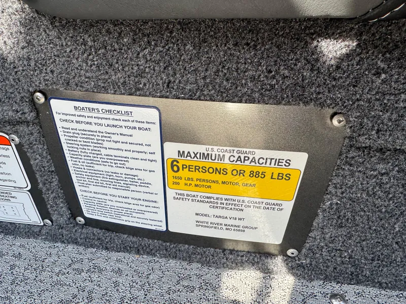 Slide: The Image of 2023 Tracker Targa V-18 WT capacity plate, showing maximum 6 persons or 885 lbs limit. - 10