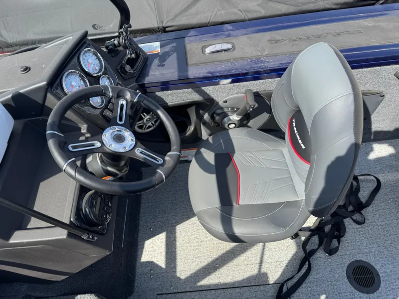 Slide: The Image of 2023 Tracker Targa V-18 WT boat interior with steering wheel and seat. - 12