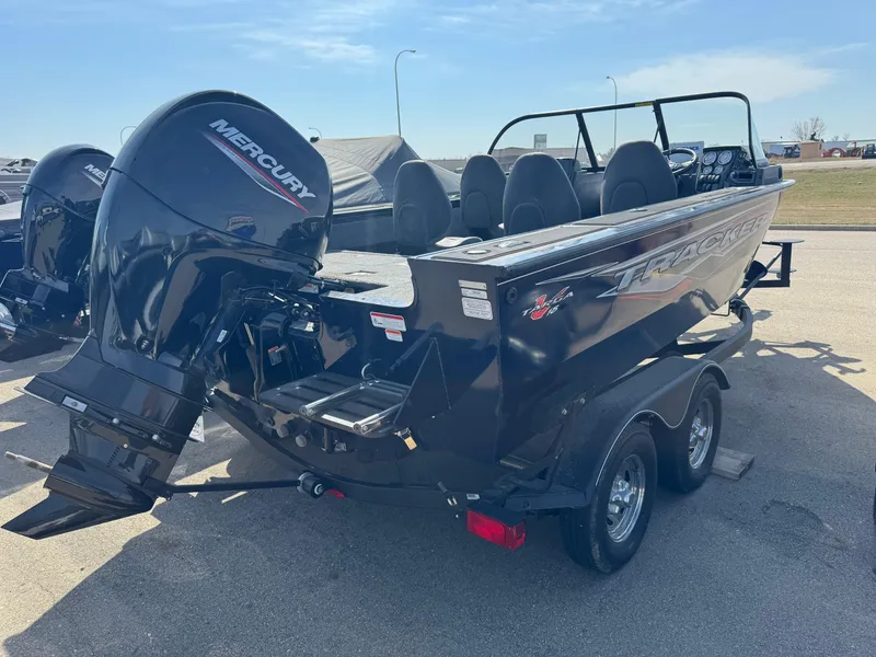 Slide: The Image of 2023 Tracker Targa V-18 WT boat with Mercury engine on trailer. - 2