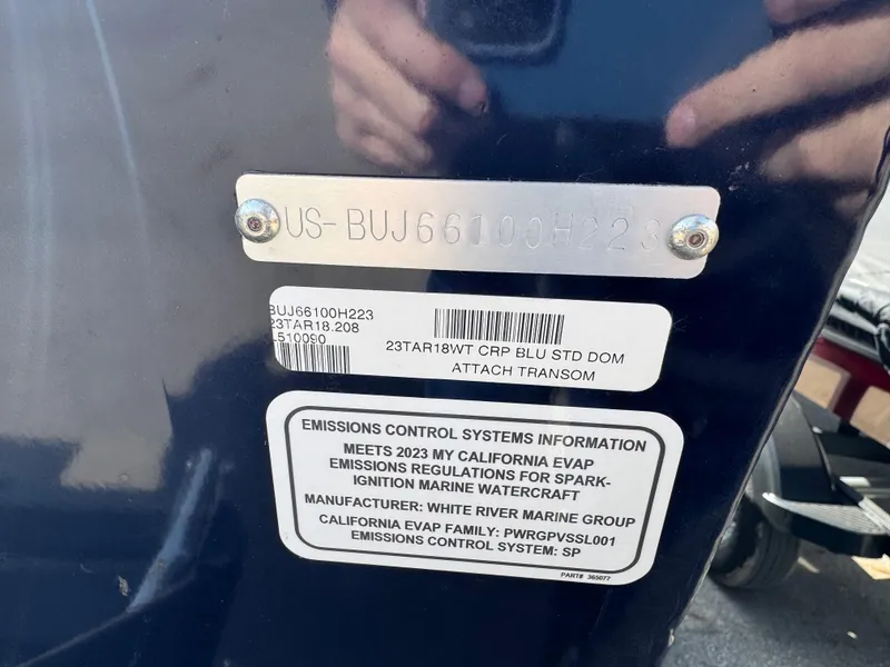 Slide: The Image of 2023 Tracker Targa V-18 WT boat transom with emissions control information and serial number plate. - 3